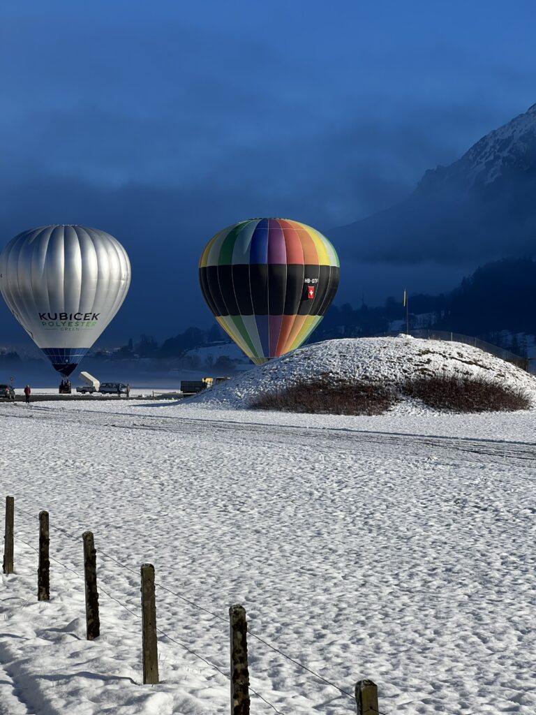 Swiss mountains imaeg with hot baloons